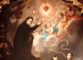 A painting of Saint Aloysius Gonzaga pointing to the Sacred Heart of Jesus with angels around it